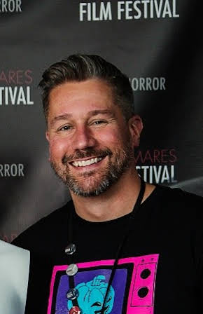 Jason Tostevin as Director