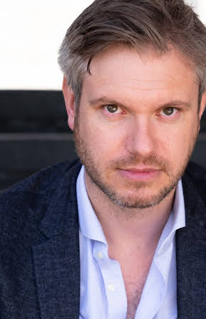 Oliver Birch as Policy Strategist 1