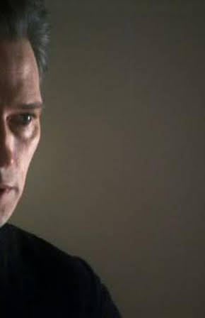 Darren E. Burrows as Elliot Hull