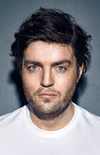 Tom Burke as 