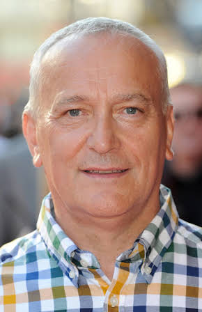 Simon Greenall as 