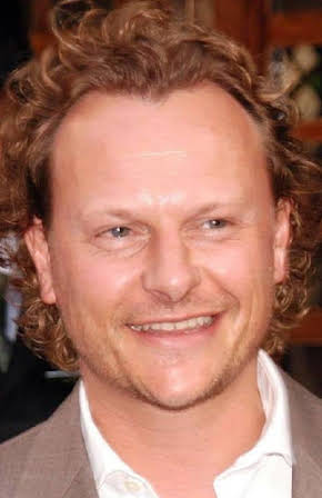Neil Stuke as 