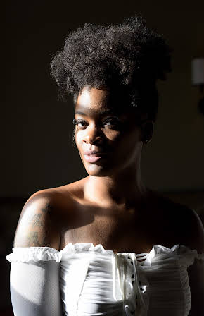 Ari Lennox as 