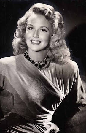 Janis Carter as 