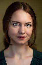 Alix Austin as Director