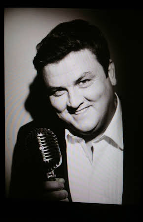 Simon Delaney as 