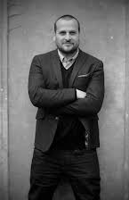 Marek Losey as Director