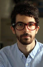 Ido Fluk as Director