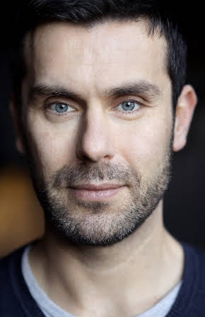 Roni Ezra as Director