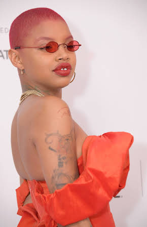 Slick Woods as 