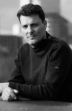 Joël Vanhoebrouck som Director