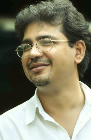 Rensil D'Silva as Director