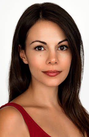 Sabine Palfi as Newscaster