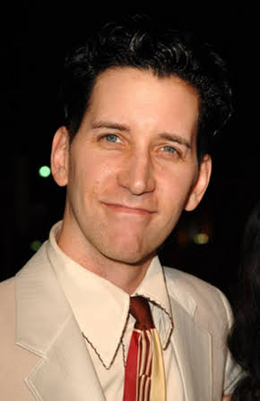 Dan John Miller as NPR Host