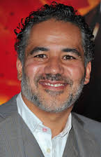 John Ortiz as 