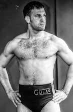 Drew Gulak as 