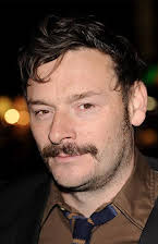Julian Barratt som 