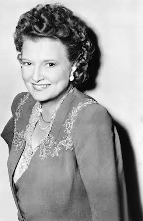 Phyllis Povah as 