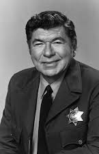 Claude Akins como Elwood Coates
