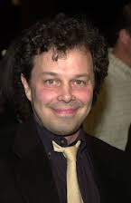 Curtis Armstrong como 