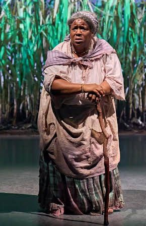 Llewella Gideon as Job Centre Worker