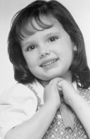 Brittany Ashton Holmes as 