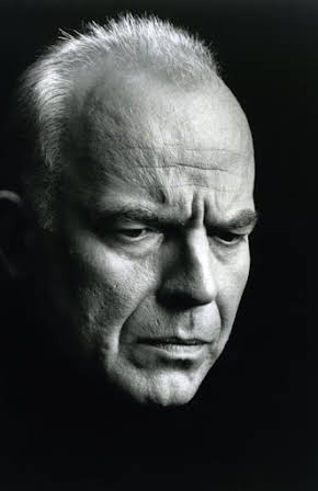 John Shrapnel as 