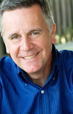 Paul Ryden como TV News Anchor