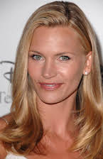 Natasha Henstridge como 