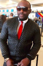 Jim Iyke as 