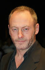 Liam Cunningham as 