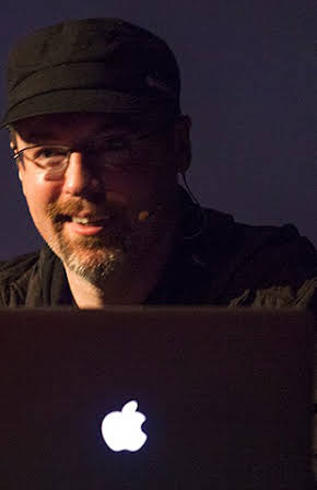 Ruairi Robinson as Director