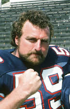 John Matuszak como 