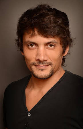 Daniel Holguín as 