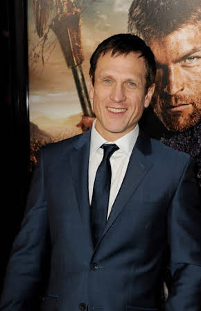 Simon Merrells as 