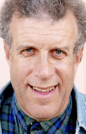 Carl Solomon as DJ Valerie Grillz