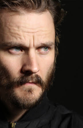 Travis Hammer as 