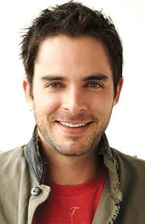Manolo Cardona as 