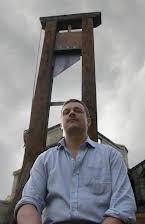 Glenn McQuaid as Director