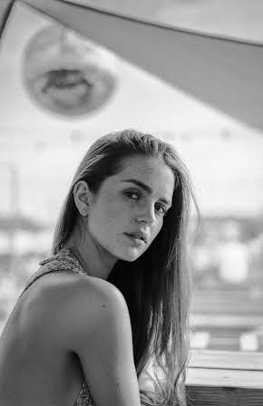Greta James as 