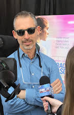 David Aaron Cohen som Director