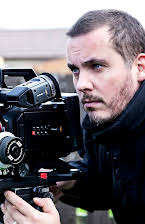 David Ryan Keith as Director