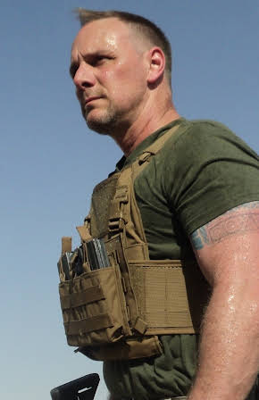 Brett Jones as Director