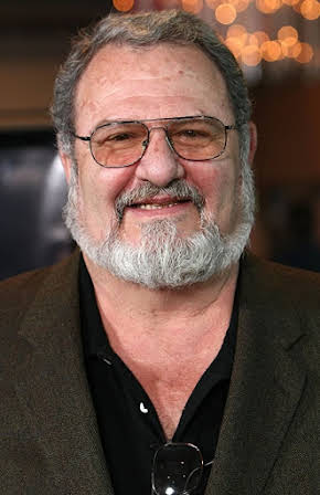John Milius as 