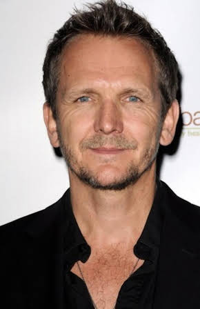 Sebastian Roché as 