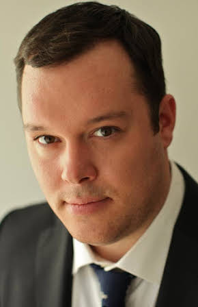 Michael Gladis as 