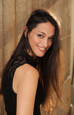 Sara Tomko as 