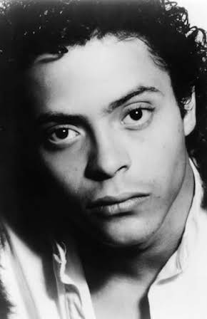 Michael Carmine as 