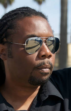 Dwayne Alexander Smith as Director