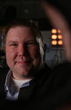 Marc Menet som Director